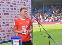 Kal Naismith picking up his player of the match award following his performance against Nottingham Forest