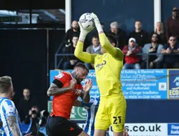 Lee Nicholls claims the ball over Sonny Bradley