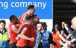 Sonny Bradley celebrates with the crowd after his goal