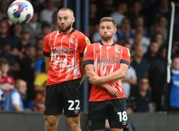 Allan Campbell and Jordan Clark face up to a free kick