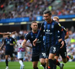 Dan Potts and Jordan Clark look happy after Potts goal