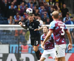 Sonny Bradley heads the ball clear