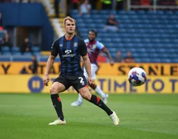 James Bree plays the ball forward