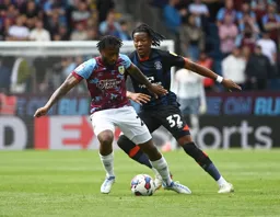 Samuel Bastien holds off Gabriel Osho`s attempt to reach the ball