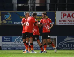 Tom Lockyer is congratulated after scoring the Town`s second goal