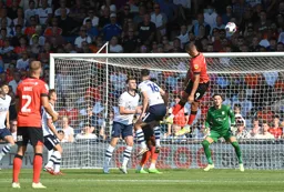 Carlton Morris`s header drifts wide of the goal