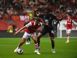 Nahki Wells holds Gabriel Osho off the ball