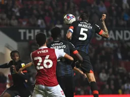 Sonny Bradley gets his head to the ball