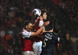 Sonny Bradley is outnumbered in this aerial dual