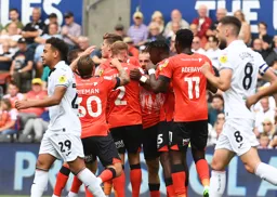 Allan Campbell is mobbed by his team mates after scoring the Town`s first goal