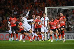 Reece Burke and Dan Potts puff their cheeks facing up to this shot by Oliver Norwood