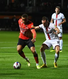 Carlton Morris comes under pressure from former Hatter Rhys Norrington-Davies