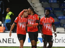 Carlton Morris gives Jordan Clark a hug after scoring his and Town`s second goal