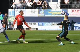 Carlton Morris scores the Town`s first goal past future Hatter Thomas Kaminski