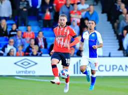 Jordan Clark looks to pass the ball forward
