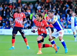 Tom Lockyer gets a push in the back from Tyrhys Dolan