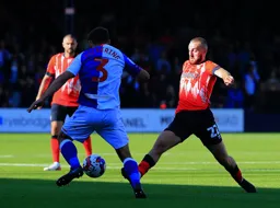 Allan Campbell gets stuck in against Harry Pickering