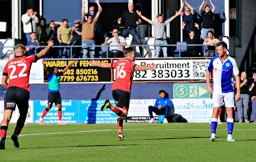 Reece Burke wheels away after scoring the second goal