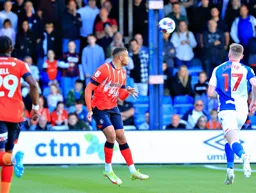 Carlton Morris heads the ball on