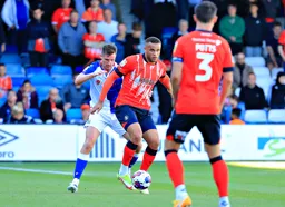 Carlton Morris holds the ball up