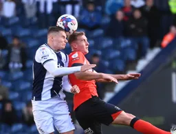 James Bree competes for the ball against Conor Townsend