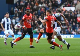 Jordan Clark plays a pass on the volley