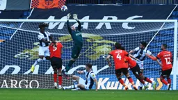 Ethan Horvath goes full stretch in an attempt to reach the ball