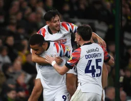 Carlton Morris looks unfazed but Harry Cornick looks delighted after Morris had scored the only goal of the game