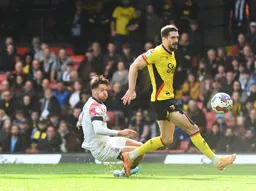 Harry Cornick slides as he pl;ays the ball past Craig Cathcart