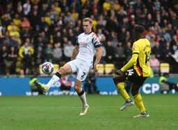 James Bree controls the ball as Hassane Kamara closes in