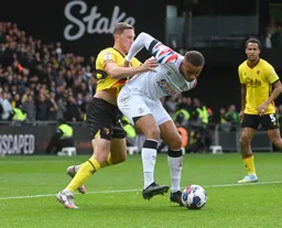 Carlton Morris backs into Dan Gosling