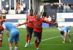 Carlton Morris shows his delight after scoring the Town`s goal