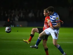 Luke Berry tussles for the ball with Tom Holmes