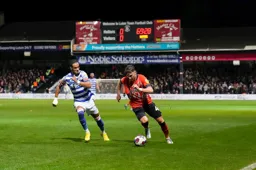 Alfie Doughty is closed down by former Hatter Tom Ince