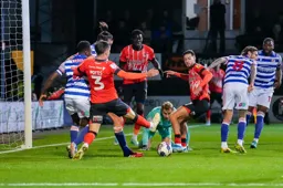 The ball runs loose in the Reading penalty area but Dan Potts and Harry Cornick cannot convert