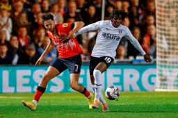 Harry Cornick is held off the ball by Brooke Norton-Cuffy
