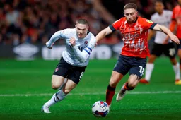 Jordan Clark and Ben Wiles chase after the ball