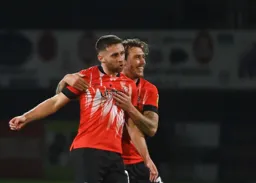 Jordan Clark and Luke Freeman celebrate Town`s last minute goal