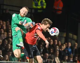 Viktor Johansson and Luke Berry compete for the ball