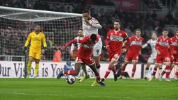 Isaiah Jones takes the ball away from Carlton Morris