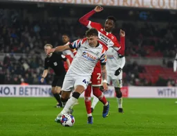 Alfie Doughty shrugs of Isaiah Jones