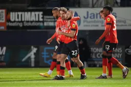 An arm round the shoulder for Allan Campbell after he has scored the Town`s first goal