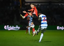 Jordan Clark attempts to block Kenneth Paal`s clearance