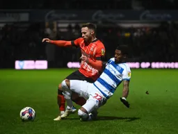 Jordan Clark is tackled by Kenneth Paal