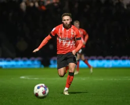 Jordan Clark runs with the ball