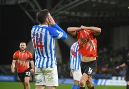 Reece Burke goes to remove his shirt after scoring the Town`s late winner