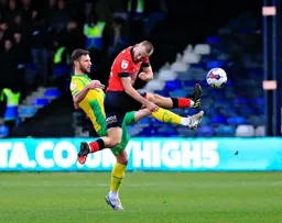 Allan Campbell flies in to reach the ball