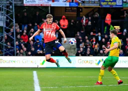 Alfie Doughty flicks the ball on