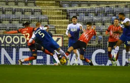 Gabriel Osho and Reece Burke combine to block Jack Whatmough