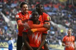 Elijah Adebayo celebrates after scoring the second goal with Harry Cornick and Pelly Ruddock Mpanzu
